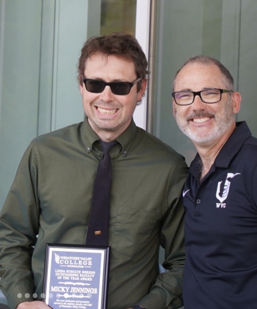 Micky Jennings, left, displaying his Outstanding Faculty of the Year award with another WVC representative